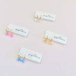 mini star charm gold huggie earrings